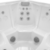 A white hot tub with four jets and two controls