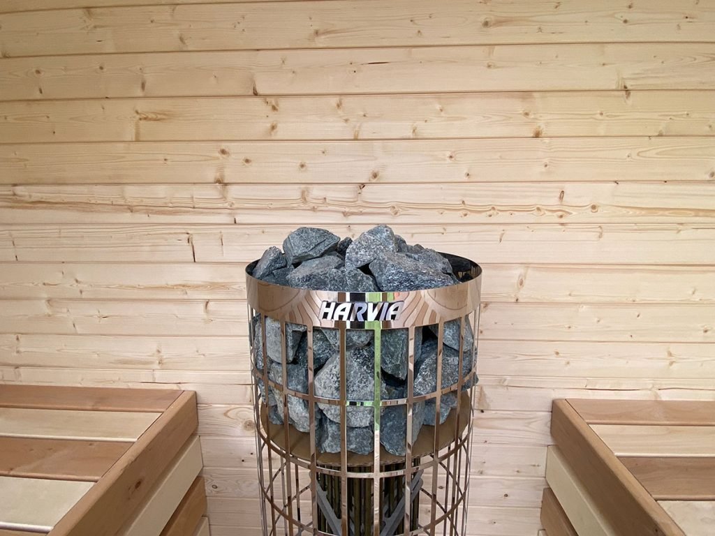 a basket of rocks in a sauna