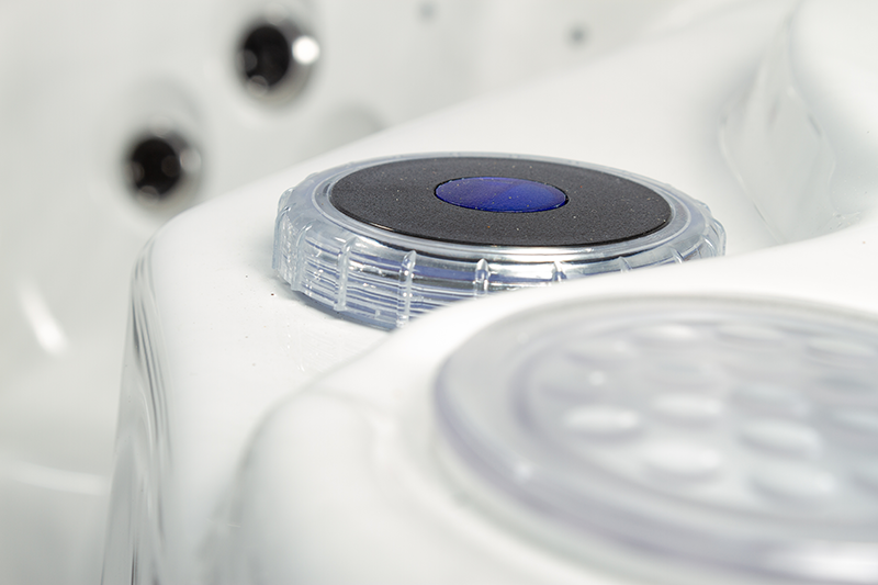 A white hot tub with many different types of buttons