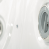 a white square tub with silver buttons