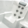 a white bathtub with silver buttons