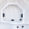 a white hot tub with a hexagon shaped center